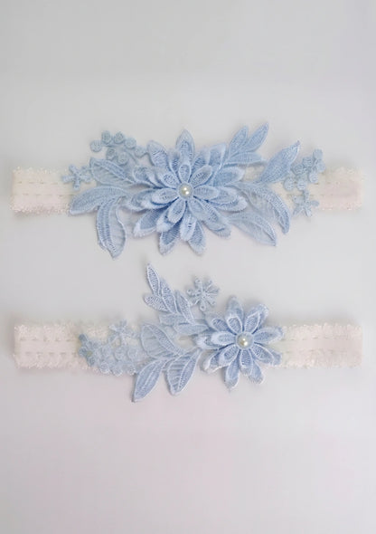 Spitzenblaue Hochzeitsstrumpfband